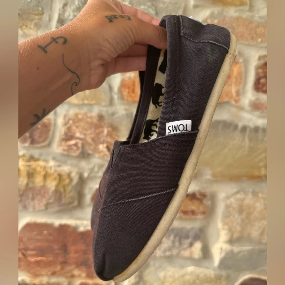 TOMS black casual slip ons